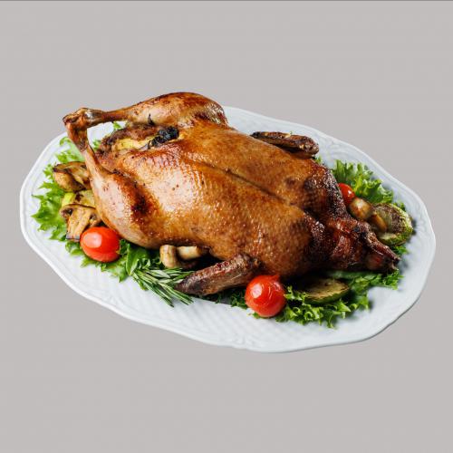 Качка фарширована апельсинами та яблуками